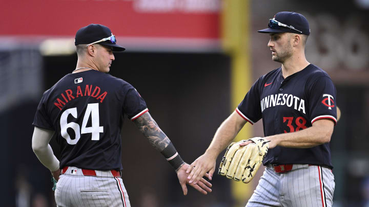 Minnesota Twins right fielder Matt Wallner (38) and third baseman Jose Miranda (64) celebrate on the field after defeating the San Diego Padres at Petco Park in San Diego on Aug. 21, 2024. 