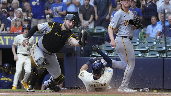 Milwaukee Brewers outfielder Isaac Collins (6) slides under the tag of Pittsburgh Pirates catcher Joey Bart (14) in the fourth inning at American Family Field on Wednesday. Milwaukee Brewers outfielder Isaac Collins (6) slides under the tag of Pittsburgh Pirates catcher Joey Bart (14) in the fourth inning at American Family Field on Wednesday.