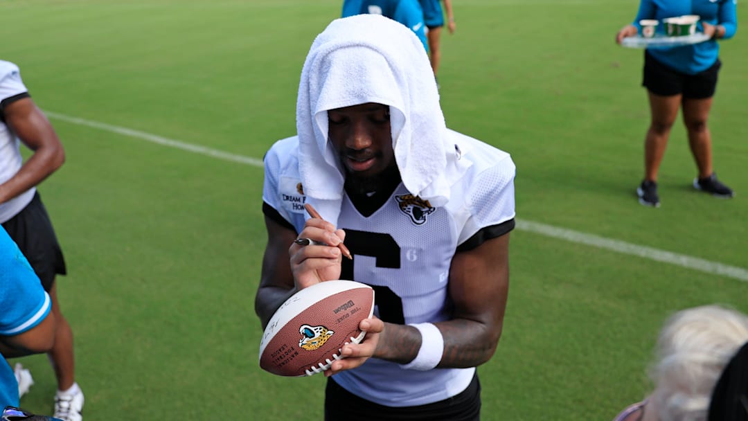 Jacksonville Jaguars safety Darnell Savage (6) signs autographs after an NFL training camp session at the Miller Electric Center, Friday, July 25, 2025, in Jacksonville, Fla.