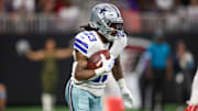 Nov 3, 2024; Atlanta, Georgia, USA; Dallas Cowboys running back Rico Dowdle (23) runs the ball against the Atlanta Falcons in the first quarter at Mercedes-Benz Stadium. Mandatory Credit: Brett Davis-Imagn Images