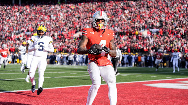 Ohio State wide receiver Jeremiah Smith (4) makes a catch for a touchdown against Michigan
