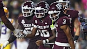 Texas A&M Aggies quarterback Marcel Reed (10) celebrates with wide receiver Ashton Bethel-Roman (3) after a play during the second half against the Louisiana State Tigers at Tiger Stadium.