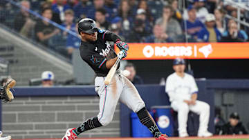 Miami Marlins second baseman Otto Lopez (61) hits a single against the Toronto Blue Jays in September 2024.