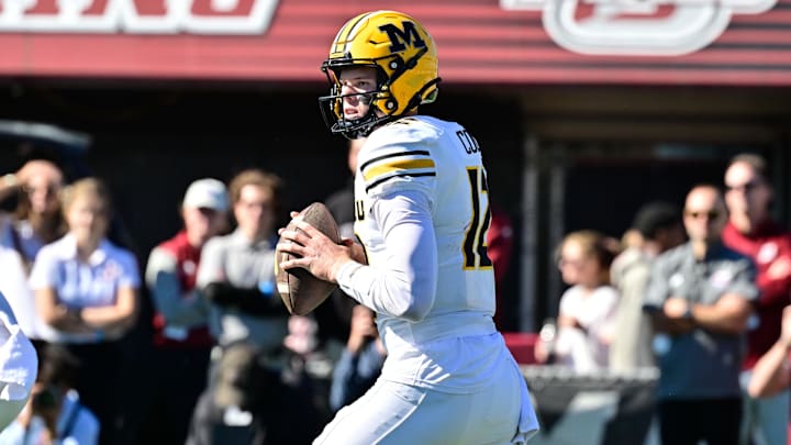 Oct 12, 2024; Amherst, Massachusetts, USA; Missouri Tigers quarterback Brady Cook (12)  looks to pass against the Massachusetts Minutemen during the first half at Warren McGuirk Alumni Stadium. Mandatory Credit: Eric Canha-Imagn Images