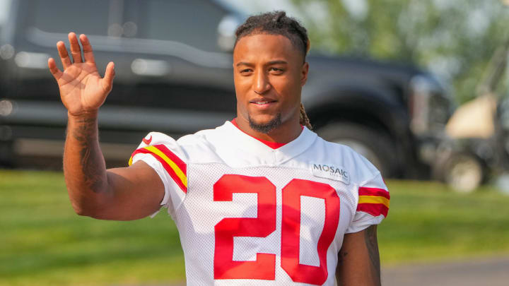 Jul 26, 2024; Kansas City, MO, USA; Kansas City Chiefs safety Justin Reid (20) waves to fans while walking down the hill from the locker room to the fields prior to training camp at Missouri Western State University. Mandatory Credit: Denny Medley-USA TODAY Sports