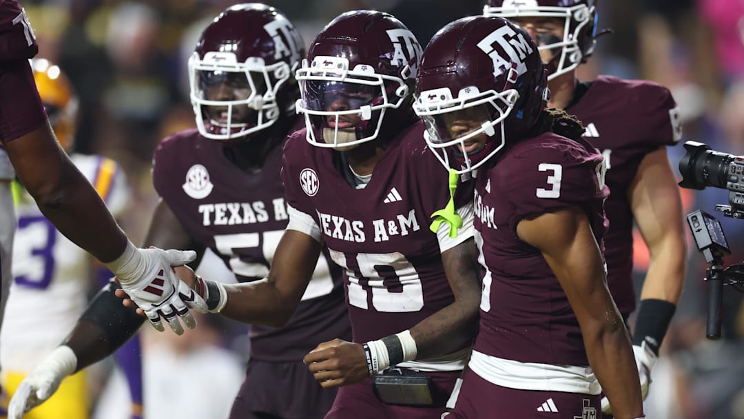 Oct 25, 2025; Baton Rouge, Louisiana, USA; Texas A&M Aggies quarterback Marcel Reed (10) celebrates with wide receiver Ashton Bethel-Roman (3) after a play during the second half against the Louisiana State Tigers at Tiger Stadium. Mandatory Credit: Stephen Lew-Imagn Images
