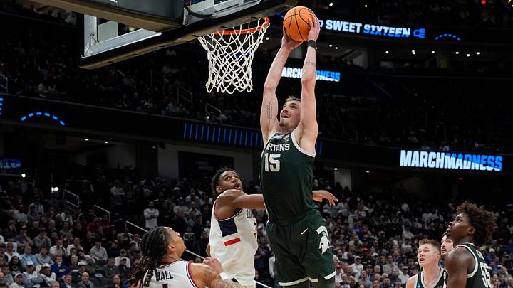 Michigan State center Carson Cooper (15) goes in for the dunk during the second half of the 2026 NCAA Men's Basketball East Regional game against UConn at Capital One Arena in Washington DC on Friday, March 27, 2026. 
Michigan State lost the game 67-63.