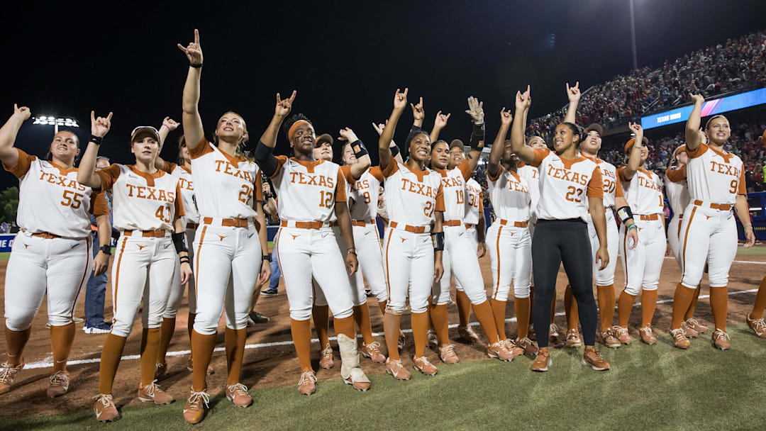 Jun 4, 2025; Oklahoma City, OK, USA;  Texas Longhorns players chant towards the fans after defeating the Texas Tech Red Raiders 2-1 in game one of the NCAA Softball Women's College World Series finals at Devon Park. Mandatory Credit: Brett Rojo-Imagn Images