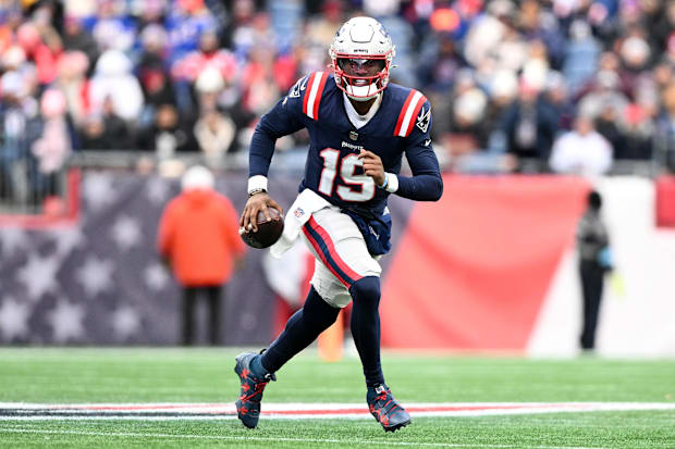 New England Patriots QB Joe Milton III runs against the Buffalo Bills during the first half at Gillette Stadium.