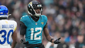 Oct 19, 2025; London, United Kingdom; Jacksonville Jaguars wide receiver Travis Hunter (12) reacts after a play against the Los Angeles Rams during the second half of an NFL International Series game at Wembley Stadium. Mandatory Credit: Kirby Lee-Imagn Images