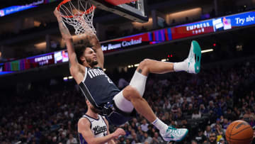 Mar 29, 2024; Sacramento, California, USA; Dallas Mavericks center Dereck Lively II (2) hangs on the