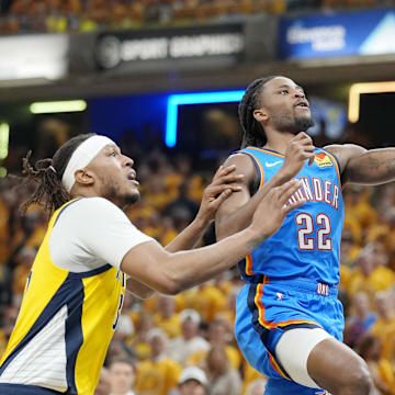 Jun 13, 2025; Indianapolis, Indiana, USA; Oklahoma City Thunder guard Cason Wallace (22) shoots the ball against Indiana Pacers center Myles Turner (33) during the first half during game four of the 2025 NBA Finals at Gainbridge Fieldhouse. Mandatory Credit: Kyle Terada-Imagn Images