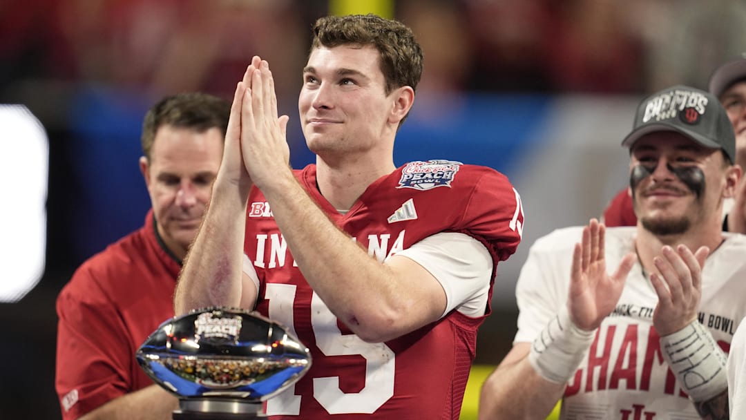 Jan 9, 2026; Atlanta, GA, USA; Indiana Hoosiers quarterback Fernando Mendoza (15) reacts after the 2025 Peach Bowl and semifinal game of the College Football Playoff at Mercedes-Benz Stadium. Mandatory Credit: Dale Zanine-Imagn Images