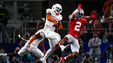 Ohio State receiver Emeka Egbuka has a catch broken up by Texas Longhorns defensive back Jahdae Barron (7) in the Cotton Bowl. Barron finished the season with 46 solo tackles, five interceptions and 11 passes defended.