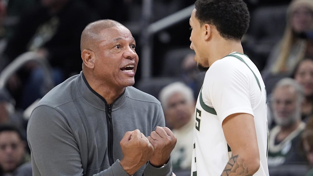 Milwaukee Bucks head coach Doc Rivers has a talk with Milwaukee Bucks guard Ryan Rollins (13) in the first half against the Houston Rockets at Fiserv Forum on November 9, 2025. 