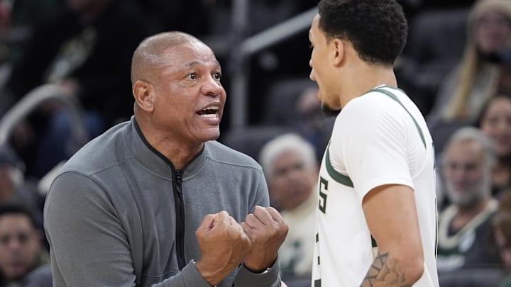 Milwaukee Bucks head coach Doc Rivers has a talk with Milwaukee Bucks guard Ryan Rollins (13) in the first half against the Houston Rockets at Fiserv Forum on November 9, 2025. 