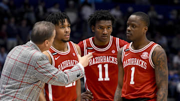 Mar 13, 2025; Nashville, TN, USA;  Arkansas Razorbacks head coach John Calipari talks with guard D.J. Wagner (21), forward Karter Knox (11), and guard Johnell Davis (1) against the Mississippi Rebels during the second half at Bridgestone Arena. Mandatory Credit: Steve Roberts-Imagn Images