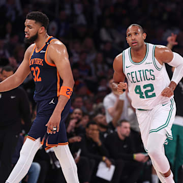 May 12, 2025; New York, New York, USA; Boston Celtics center Al Horford (42) runs up court after making a three point basket in the first half during game four of the second round for the 2025 NBA Playoffs as New York Knicks center Karl-Anthony Towns (32) reacts at Madison Square Garden. Mandatory Credit: Vincent Carchietta-Imagn Images
