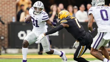 Sep 16, 2023; Columbia, Missouri, USA; Kansas State Wildcats running back DJ Giddens (31) runs the ball against Missouri Tigers defensive back Jaylon Carlies (1) during the first half at Faurot Field at Memorial Stadium. Mandatory Credit: Jay Biggerstaff-USA TODAY Sports