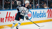 Nov 11, 2025; Vancouver, British Columbia, CAN; Winnipeg Jets defenseman Josh Morrissey (44) handles the puck against the Vancouver Canucks in the second period at Rogers Arena. Mandatory Credit: Bob Frid-Imagn Images