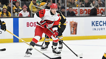 Nov 1, 2025; Boston, Massachusetts, USA; Carolina Hurricanes left wing Nikolaj Ehlers (27) looks to pass the puck during the second period against the Boston Bruins at TD Garden. Mandatory Credit: Eric Canha-Imagn Images