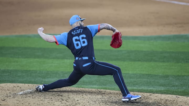 Jul 16, 2024; Arlington, Texas, USA; National League pitcher Tanner Scott of the Miami Marlins (66) pitches in the eight inning during the 2024 MLB All-Star game at Globe Life Field. Mandatory Credit: Tim Heitman-USA TODAY Sports