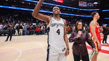 Feb 5, 2025; Atlanta, Georgia, USA; San Antonio Spurs guard De'Aaron Fox (4) after a victory over the Atlanta Hawks at State Farm Arena. Mandatory Credit: Brett Davis-Imagn Images