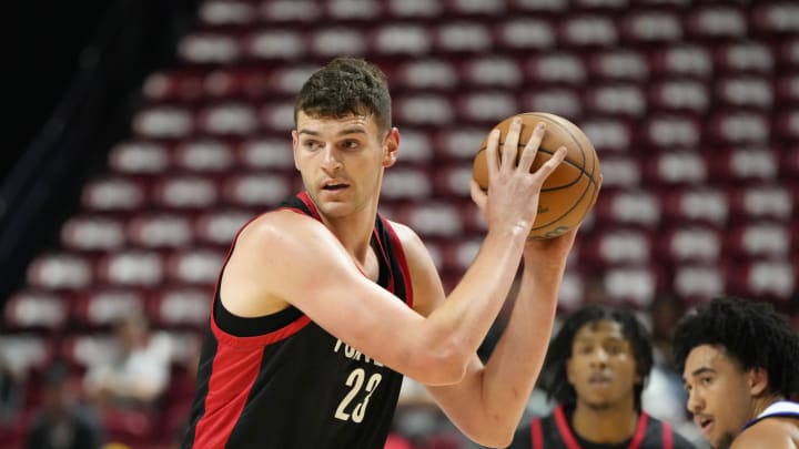 Jul 15, 2024; Las Vegas, NV, USA; Portland Trail Blazers center Donovan Clingan (23) controls the ball against the Philadelphia 76ers  during the first half at Thomas & Mack Center. Mandatory Credit: Lucas Peltier-USA TODAY Sports