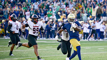 Sep 7, 2024; South Bend, Indiana, USA; Notre Dame Fighting Irish running back Jeremiyah Love (4) scores in the third quarter against the Northern Illinois Huskies at Notre Dame Stadium. Mandatory Credit: Matt Cashore-Imagn Images