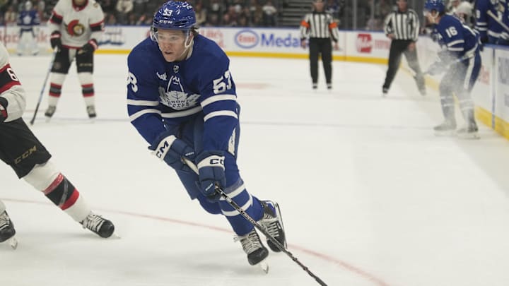 Sep 25, 2023; Toronto, Ontario, CAN; Toronto Maple Leafs forward Easton Cowan (53) skates with the puck against the Ottawa Senators during overtime at Scotiabank Arena. Mandatory Credit: John E. Sokolowski-Imagn Images