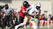 Oct 11, 2025; Cincinnati, Ohio, USA; Cincinnati Bearcats linebacker Jake Golday (11) attempts to tackle UCF Knights quarterback Cam Fancher (14) in the second half at Nippert Stadium. Mandatory Credit: Aaron Doster-Imagn Images