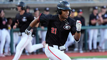 Georgia outfielder Devin Obee (21) runs for first during a NCAA baseball game against Arkansas in Athens, Ga., on Friday, April 11, 2025.