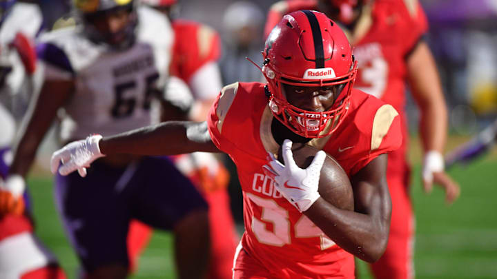 Cardinal Mooney running back Connail Jackson scores in the Cougars' Fall Classic game against Booker.