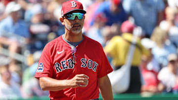 Boston Red Sox manager Alex Cora (13) looks on during the first inning against the Philadelphia Phillies at BayCare Ballpark.