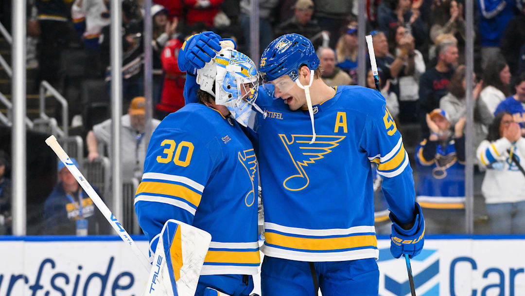 Mar 24, 2026; St. Louis, Missouri, USA; St. Louis Blues goaltender Joel Hofer (30) celebrates with defenseman Colton Parayko (55) after the Blues defeated the Washington Capitals at Enterprise Center. Mandatory Credit: Jeff Curry-Imagn Images