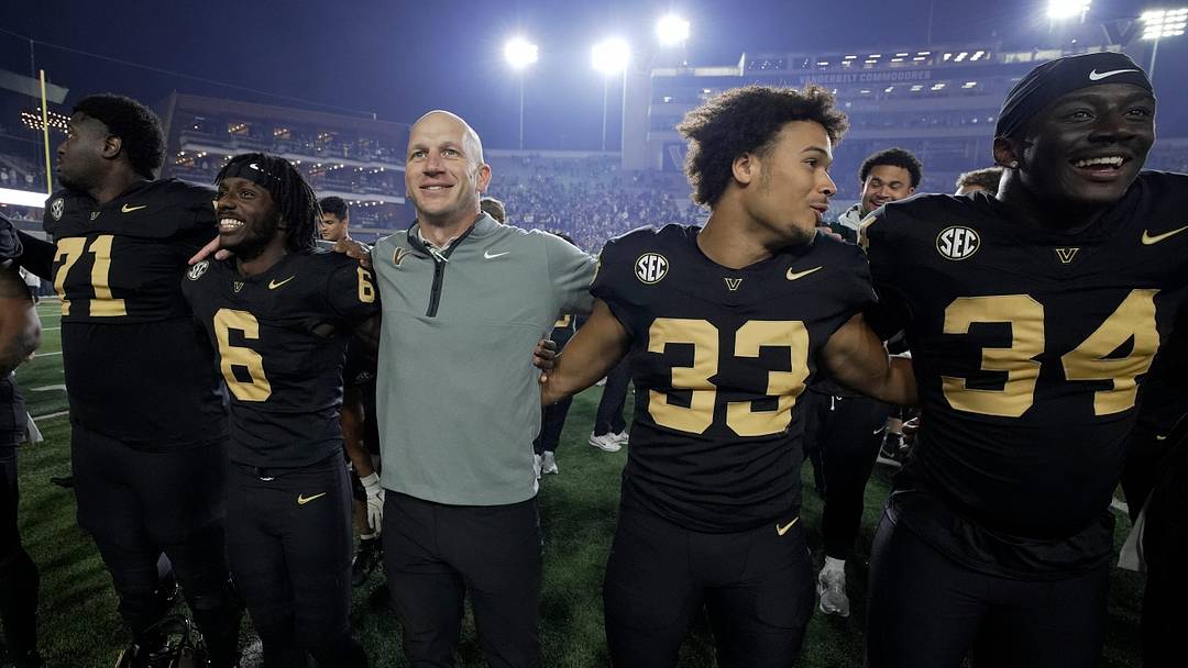 Vanderbilt coach Clark Lea celebrates with his players after the team’s win against Kentucky at FirstBank Stadium in Nashville, Tenn., Saturday, Nov. 22, 2025.