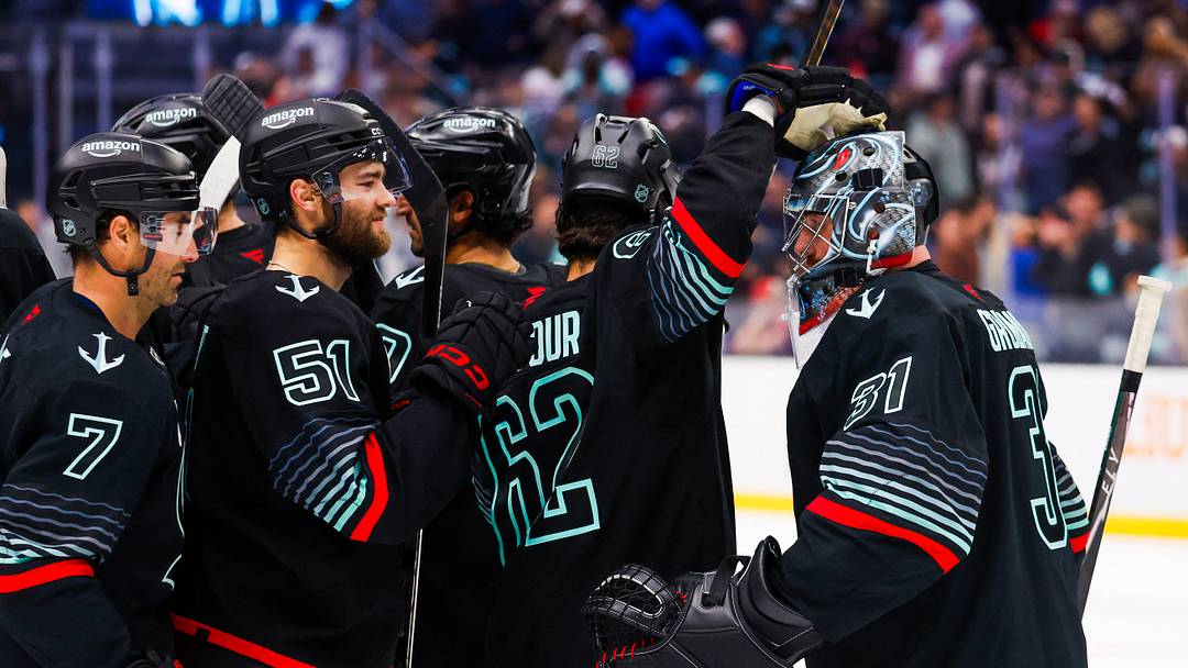Oct 20, 2026; Seattle, Washington, USA; Seattle Kraken goaltender Philipp Grubauer (31) celebrates an overtime shootout victory against the Detroit Red Wings with right wing Jordan Eberle (7), center Shane Wright (51) and defenseman Brandon Montour (62) at Climate Pledge Arena. Mandatory Credit: Joe Nicholson-Imagn Images