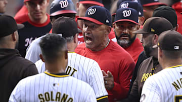 Washington Nationals bench coach Miguel Cairo (22) talks to San Diego Padres manager Mike Shildt (8) during a benches-clearing altercation in the first inning at Petco Park on June 25, 2024.