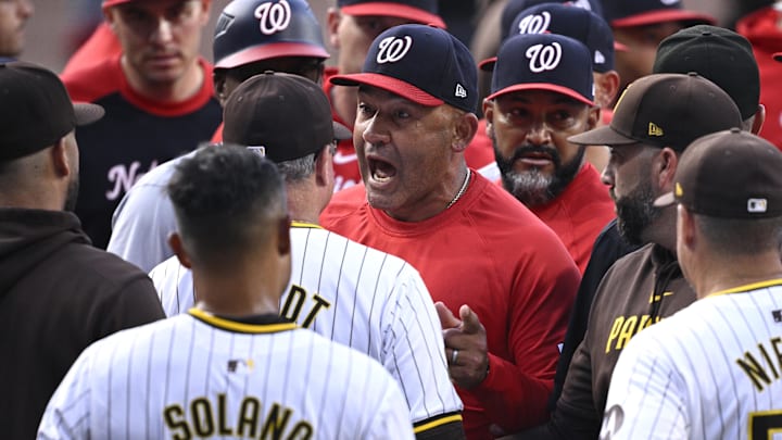 Washington Nationals bench coach Miguel Cairo (22) talks to San Diego Padres manager Mike Shildt (8) during a benches-clearing altercation in the first inning at Petco Park on June 25, 2024.