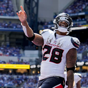 Houston Texans running back Joe Mixon (28) celebrates after scoring a touchdown Sunday, Sept. 8, 2024, during a game against the Indianapolis Colts at Lucas Oil Stadium in Indianapolis.