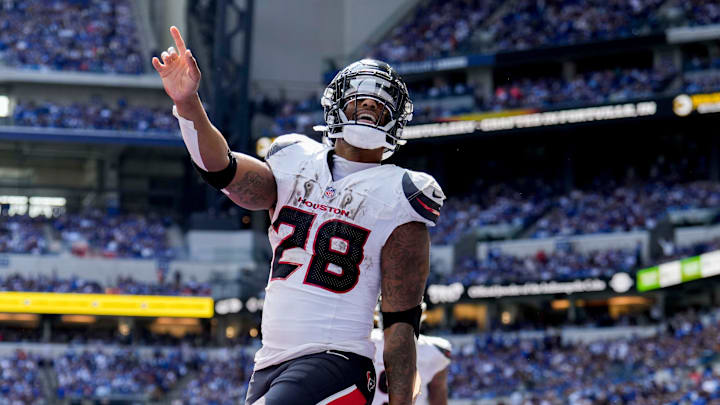 Houston Texans running back Joe Mixon (28) celebrates after scoring a touchdown Sunday, Sept. 8, 2024, during a game against the Indianapolis Colts at Lucas Oil Stadium in Indianapolis.