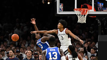 Nov 15, 2025; Boston, Massachusetts, USA; UConn Huskies forward Jaylin Stewart (3) defends a shot by BYU Cougars forward AJ Dybantsa (3) during the first half at TD Garden. Mandatory Credit: Eric Canha-Imagn Images