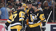 Sep 27, 2025; Pittsburgh, Pennsylvania, USA;  Pittsburgh Penguins goaltender Marc-Andre Fleury (29) is embraced by center Evgeni Malkin (71) and center Sidney Crosby (87) and defenseman Kris Letang (58) after his final NHL game to defeat the Columbus Blue Jackets at PPG Paints Arena. Mandatory Credit: Charles LeClaire-Imagn Images
