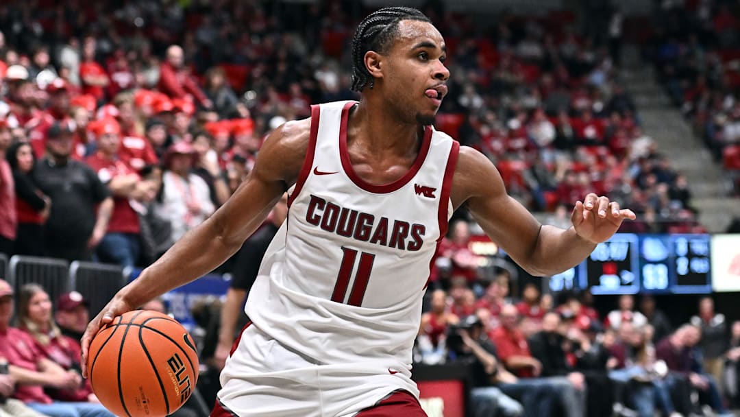 Jan 15, 2026; Pullman, Washington, USA; Washington State Cougars guard Jerone Morton (11) controls the ball against the Gonzaga Bulldogs in the second half at Friel Court at Beasley Coliseum. Mandatory Credit: James Snook-Imagn Images