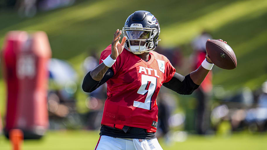 Michael Penix Jr. throws a ball during Falcons training camp
