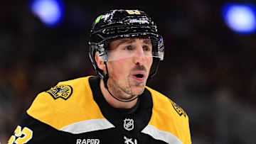 Oct 24, 2024; Boston, Massachusetts, USA;  Boston Bruins left wing Brad Marchand (63) has words with the referee after being called for a cross checking penalty during the third period against the Dallas Stars at TD Garden. Mandatory Credit: Bob DeChiara-Imagn Images