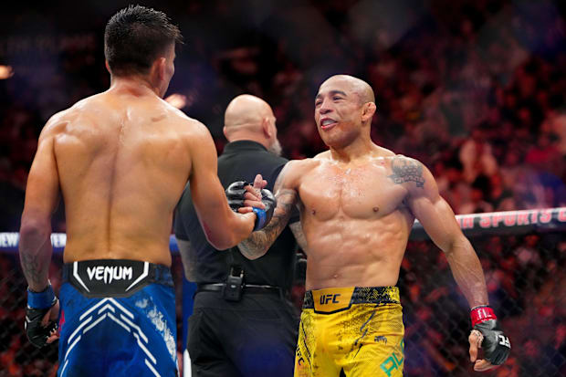 Jose Aldo (red gloves) shakes hands with Mario Bautista (blue gloves) after their fight during UFC 307 at Delta Center.