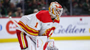 Nov 9, 2025; Saint Paul, Minnesota, USA; Calgary Flames goaltender Devin Cooley (1) looks on during the second period against the Minnesota Wild at Grand Casino Arena. Mandatory Credit: Matt Krohn-Imagn Images