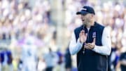 Sep 21, 2024; Seattle, Washington, USA; Northwestern Wildcats head coach David Braun watches pregame warmups against the Washington Huskies at Alaska Airlines Field at Husky Stadium. Mandatory Credit: Joe Nicholson-Imagn Images