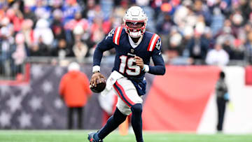 Jan 5, 2025; Foxborough, Massachusetts, USA; New England Patriots quarterback Joe Milton III (19) runs against the Buffalo Bills during the first half at Gillette Stadium. Mandatory Credit: Brian Fluharty-Imagn Images
